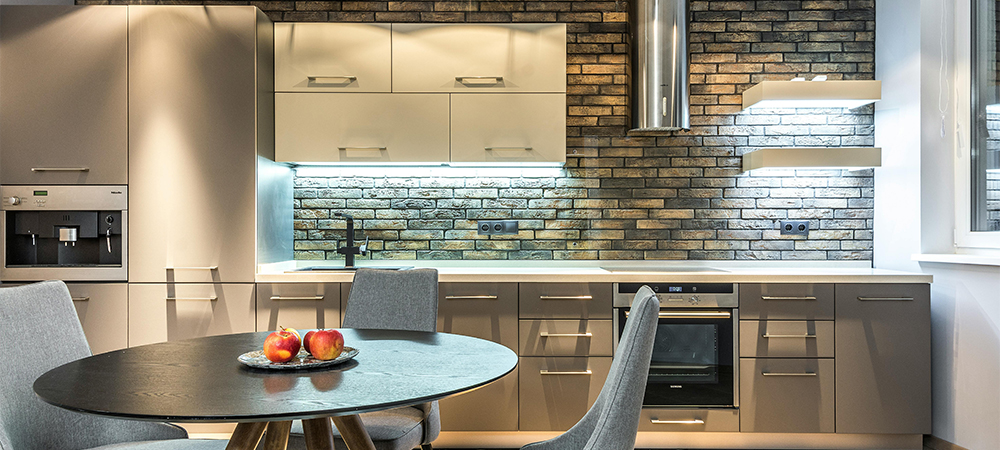 A small kitchen with an extended tile backsplash for a seamless design