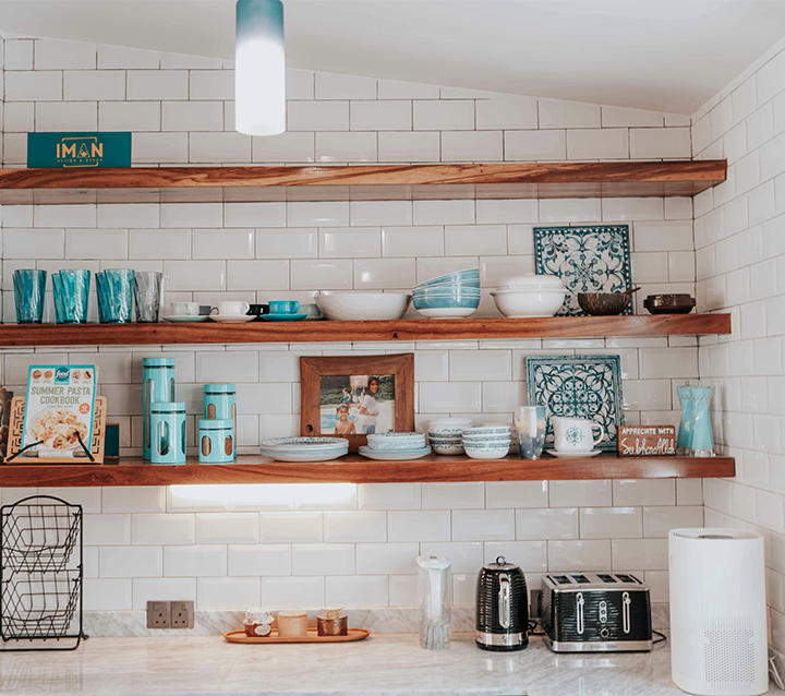 Personalize Small Kitchens with Decorative Cookbooks A small kitchen with neatly displayed cookbooks for added personality