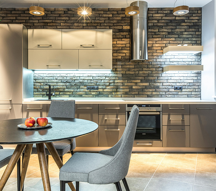 A small kitchen with an extended tile backsplash for a seamless design