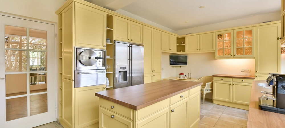 Bold Yellow Kitchen Cabinets for a Cheerful Space Vibrant kitchen featuring bold yellow cabinets for a lively atmosphere