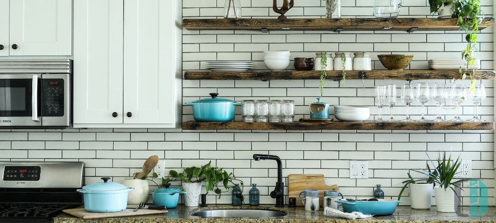 Kitchen with floating shelves integrated with cabinets, offering stylish and practical storage