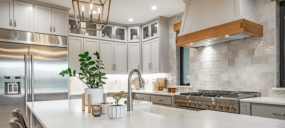 Kitchen with neutral tone cabinets creating a timeless and elegant look