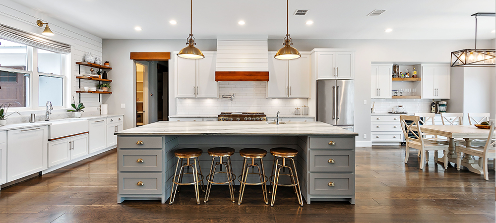 Kitchen with neutral tone cabinets creating a timeless and elegant look