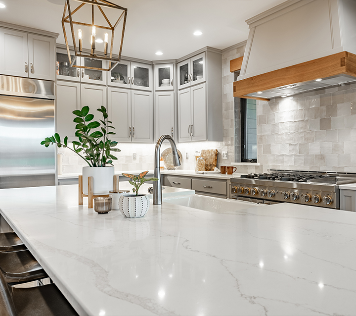 Kitchen with neutral tone cabinets creating a timeless and elegant look