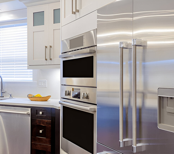 Kitchen with neutral tone cabinets creating a timeless and elegant look