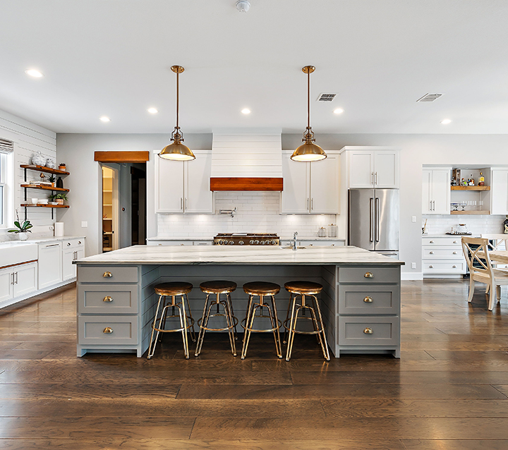 Kitchen with neutral tone cabinets creating a timeless and elegant look