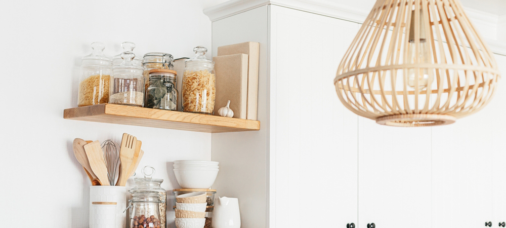 White kitchen cabinets with open wooden shelves, creating a two-tone effect.