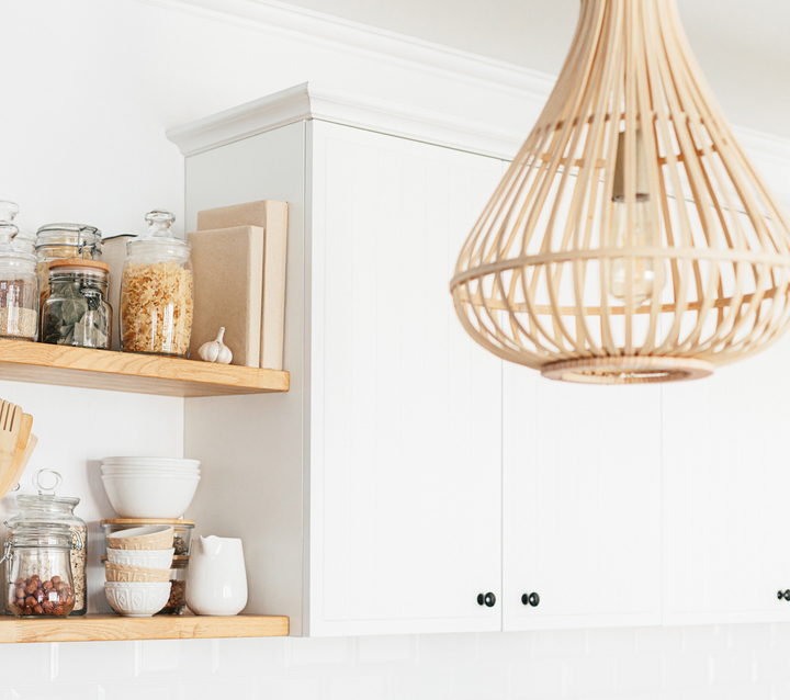 White kitchen cabinets with open wooden shelves, creating a two-tone effect.